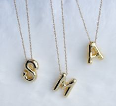 Balloon letter necklace Make a statement that is uniquely yours with our personalized initial necklaces. Choose your initials or those of someone special, and let these necklaces become an emblem of cherished connections and memories. The perfect blend of sentiment and style. Each necklace is made with high-quality materials to ensure durability.  MATERIAL AND SIZE 18k gold filled chain  Gold plated balloon letter Size pendant: 2.3cm Length chain: 45cm or 18 inches If you have questions about th Letter Beads Initial Pendant For Mother's Day, Anniversary Charm Necklace With Initial Pendant, Mother's Day Jewelry With Initial Pendant Letter Beads, Mother's Day Jewelry With Letter Beads And Initial Pendant, Mother's Day Jewelry With Letter Beads On Initial Pendant, Mother's Day Jewelry With Initial Pendant And Letter Beads, Mother's Day Initial Pendant Necklace With Letter Beads, Mother's Day Initial Necklace With Letter Beads, Initial Pendant Monogram Necklace For Personalized Gift