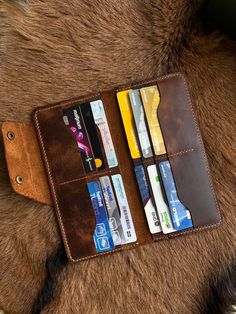 "Experience a touch of luxury and tradition with our handcrafted wallet, a piece where elegance meets practicality. Crafted by CLOT from authentic, full-grain calfskin, this wallet is not only stylish but also durable. Designed to age beautifully, the natural leather develops a unique patina that reflects your individual journey over time." improve. This wallet has an impressive capacity with 12 card slots and 2 separate compartments for bills, ensuring you have enough space to organize your ess Luxury Handmade Wallets For Gifts, Roper Wallet, Clip Wallet, Aging Beautifully, Money Clip Wallet, Long Wallet, Natural Leather, Purse Wallet, Fathers Day Gifts