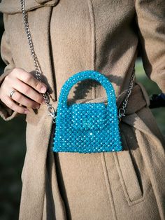 This hand-knitted children's bag stands out with its elegant shades of blue and unique craftsmanship. Each detail of this bag is meticulously crafted, resembling a small piece of art. The bright blue crystal accents create a playful sparkle on the bag, while the knitted texture adds warmth and character. Designed for children, this bag combines style and practicality. Its spacious interior allows for easy organization of daily essentials, while its sturdy knitted structure ensures long-lasting u Blue Crossbody Evening Bag As Gift, Trendy Blue Shoulder Bag For Gift, Blue Crossbody Evening Bag For Gifts, Blue Handmade Evening Bag For Everyday Use, Blue Mobile Phone Bag For Fashion Accessory, Trendy Light Blue Bag For Gift, Blue Shoulder Evening Bag For Gift, Trendy Blue Crochet Tote Bag, Blue Mobile Phone Evening Bag