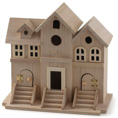 a wooden model of a house with steps leading up to the front door and windows