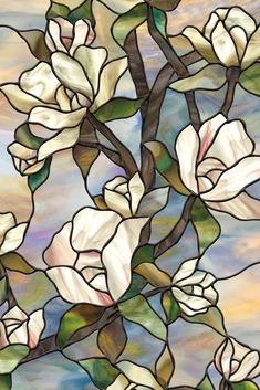 a stained glass window with white flowers on it