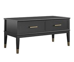 the black coffee table has two drawers on one side and an open drawer on the other