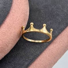 14K Solid Gold King Crown Ring ✨👑 Product Features Weight: 1.35 Gr ⚖️ Material Color: Yellow Gold, Rose Gold, and White Gold 🌈 Presentation: Shipped with a special box and bag 🎁 Returns: Right to return within 7 days 🔄 Material and Color: Product color does not fade or darken ✨ Handcraftsmanship and Uniqueness: Handcrafted and may vary by 5% (+-) 🛠️ Product Description Embrace regal elegance with the 14K Solid Gold King Crown Ring. This exquisite ring, weighing 1.35 grams, is available in three stunning colors: Yellow Gold, Rose Gold, and White Gold, offering a choice to match your personal style 🌈. Crafted with meticulous attention to detail, the King Crown design symbolizes power and majesty. Each piece is handcrafted, ensuring unique characteristics with a slight variation of 5% ( Rose Gold Crown Design Ring As Gift, Rose Gold Ring With Crown Design, Classic Crown Promise Ring, Classic Crown Shaped Promise Ring, Fine Jewelry Crown Design Rings As Gift, Fine Jewelry Crown Design Rings For Gift, Fine Jewelry Rings With Crown Design For Gift, Crown Shaped Fine Jewelry Rings For Gifts, Open Ring With Crown Design For Promise