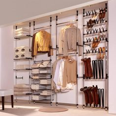 an organized closet with shoes, boots and clothing hanging on the wall next to it