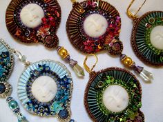 four pieces of beaded jewelry on a table