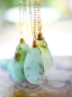 This stunning necklace is handmade with gorgeous specimens of natural Chrysoprase. This gem, also known as green Chalcedony, is said to promote joy and happiness, as well as attract love and prosperity. No two pendants are the same. Some are minty green, while others have flecks of brown, white, or black within them. The chains are sterling silver or 14k gold filled. So go ahead, flaunt your unique style! GEMSTONE: Chrysoprase STONE SIZE: 20 to 32mm (.78 to 1.25") STONE SHAPE: Irregular Smooth P Handmade Chrysoprase Necklaces In Nature Style, Unique Green Necklace With Natural Inclusions, Nature-inspired Chrysoprase Necklaces, Nature-inspired Chrysoprase Necklaces As Gift, Nature-inspired Chrysoprase Necklace As Gift, Green Prehnite Necklace For Gift, Green Moss Agate Necklace In Nature-inspired Style, Green Moss Agate Necklace Nature-inspired, Green Moss Agate Nature-inspired Necklace