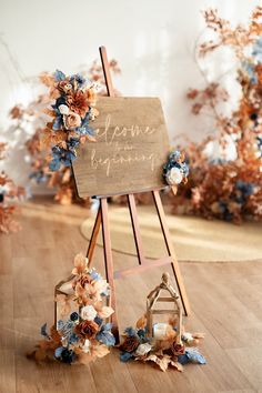 a wooden easel with flowers on the floor