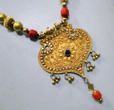 "Vintage antique tribal old solid gold and red color touchstones beads necklace. Fully handmade collection piece in good condition. Length-32 cm(12.6\") free size, easy to adjust the length by moving toggle. Size of pendant-9/6 cm, weight-62.350 grams." Handmade Red Necklace For Traditional Ceremonies, Red Bohemian Necklaces For Traditional Ceremonies, Bohemian Red Necklaces For Traditional Ceremonies, Traditional Gold Bead Necklaces For Ceremonies, Handmade Gold Beaded Necklaces For Traditional Ceremonies, Red Intricate Design Necklace For Ceremonial Occasions, Red Necklace With Intricate Design For Ceremonial Occasions, Ceremonial Red Necklace With Intricate Design, Traditional Brass Necklaces For Festivals