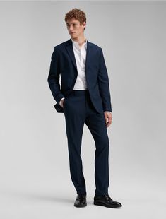 Tailored in a slim fit, this unlined Calvin Klein suit jacket is wrinkle-resistant and crafted with 4-way stretch for ease of movement. Detailed with notch lapels and multiple besom pockets in a clean, modern silhouette. Pairs with the matching Refined Stretch Slim Fit Suit Pants or works perfectly on its own.  Material: 66% Polyester, 31% Viscose, 3% Elastane. Slim Fit Suit Pants, Work Blazer, Slim Fit Suit, Calvin Klein, Suit Jacket, Slim Fit, Blazer, Pants