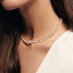 The Pearl and Diamond Tennis Necklace combines the timeless elegance of pearls with the dazzling brilliance of diamonds to create a piece of jewelry that's both classic and striking. The contrast between the lustrous freshwater pearls and the sparkling diamonds makes for a stunning visual effect. Perfect for any formal occasion or as a luxurious everyday accessory. Available in 14K Yellow Gold Diamond weight = 2.63 carats Chain length = 14in with adjustable 2in chain Pearls And Diamonds Necklace, Luxury Elegant Tennis Necklace For Formal Occasions, Nikkah Outfit, Diamond Tennis Necklace, Pearl And Diamond Necklace, Diamond Cocktail Rings, Diamond Chain, Tennis Necklace, Band Bracelet