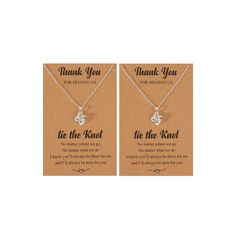 two necklaces with the words thank you for being us and he's mine