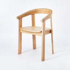 a wooden chair sitting on top of a white floor