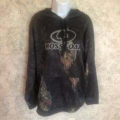 Mossy Oak Men’s Camouflage Hoodie Top This Hoodie Is Very Soft And Stretchy. It Has A Large Pocket In The Front With Two Openings On Each Side. The Fabric Of The Body Is 98% Polyester And 2% Spandex. The Lining Is 100% Polyester. Machine Washable In Cold Water And Tumble Dry. Do Not Iron. It’s New Without Tags And In Excellent Condition. Offers Are Welcomed. Camouflage Sweatshirt With Adjustable Hood For Fall, Fall Camouflage Sweatshirt With Adjustable Hood, Casual Camouflage Fleece Hoodie, Casual Camouflage Hoodie For Streetwear, Camouflage Long Sleeve Sweatshirt With Adjustable Hood, Camouflage Hooded Top For Streetwear, Casual Camouflage Sweatshirt For Outdoor Activities, Casual Camouflage Hoodie For Outdoor Activities, Casual Camouflage Tops For Outdoor Activities