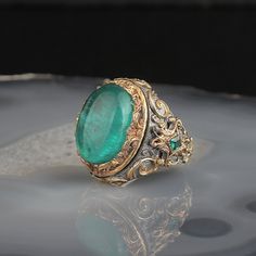 The Emperor's Paraiba percolates time-honored culture. Beautiful and bold, the Emperor's Paraiba collection is a tangible reminder of our affinities. Adorn the timeless Emperor's Paraiba ring for a more inspiring look.Origin: TurkeyMetals Type: 925 Sterling SilverMain Stone: ParaibaItem Weight: 10.00Item Type: RingColor: Silver/Gold/Green Engraved Silver Ring, Bracelets Luxury, Paraiba Tourmaline Ring, Unique Silver Rings, Mens Gemstone Rings, Signet Ring Men, Paraiba Tourmaline, Anniversary Gifts For Husband, Mens Silver Rings