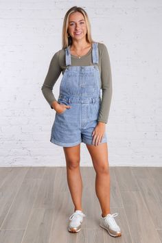 Get ready for a playful weekend with our Ramona Overalls. These cuffed denim overall shorts are in a light wash denim color and are perfect for a casual look. With adjustable straps and multiple pockets, these overalls have both style and functionality. They feature five pockets on the front and two on the back, button closures on each side, belts loops, and adjustable and removable straps. Don't miss out on these fun and versatile overalls! They are lightweight and fit true to size. 100% Cotton Utility Style Denim Jean Shorts For Spring, Casual Short Overalls For Spring, Casual Spring Overalls In Short Length, Casual Spring Overalls With Adjustable Straps, Casual Short Length Overalls For Spring, Casual Short Spring Overalls, Casual Spring Short Overalls, Spring Shortalls With Adjustable Straps And Relaxed Fit, Blue Casual Shortalls With Adjustable Straps