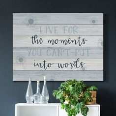 a wooden sign that says live for the moments you can't put into words