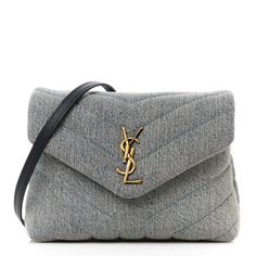 This is an authentic SAINT LAURENT Denim Y Quilted Monogram Toy Loulou Crossbody Bag in Grey. This elegant shoulder bag is crafted of chic chevron quilted denim. The bag features a black leather shoulder strap and gold hardware. The front flap features a prominent gold YSL monogram detail and opens to a partitioned black fabric interior with a zipper pocket and card slots. Saint Laurent Denim, Quilted Toys, Quilted Denim, Chevron Quilt, Saint Laurent Bag, D 2, Black Fabric, Gold Hardware, Patch Pocket