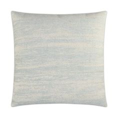 a light blue and white pillow on a white background