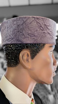 Introducing the "Nigerian Nebula Velvet Hat," an exquisite masterpiece from Dupsie's African Fashion, a beacon of African fashion for men, yet universally designed for women and children too. Crafted with meticulous precision in the heart of Nigeria, this grey iridescent African velvet hat is not just an accessory; it's a celebration of rich African heritage and contemporary style. Standing at an elegant height of approximately 3.5 inches, the hat boasts a subtle yet captivating light purplish t African Fashion For Men, African Hat, African Hats, African Accessories, Velvet Hat, African Heritage, Hat Stands, African Men Fashion, Fashion For Men