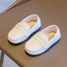 Step into Style and Comfort with Boys' Leather School Loafers Make a statement with our Boys' Leather School Loafers, the perfect blend of simplicity, style, and comfort for your little one's formal occasions. Key Features: Anti-Slippery Feature: Designed to provide stability and safety for active kids. Insole Material: Crafted with PU for added cushioning and support. Outsole Material: Made of durable rubber for long-lasting wear and traction. Gender: Unisex design suitable for both boys and gi White Round Toe Dress Shoes For Summer, Summer White Round Toe Dress Shoes, Classic Summer Slip-ons With Round Toe, Non-slip Round Toe Slip-ons For Spring, Spring Non-slip Round Toe Slip-ons, Classic White Leather Shoes For Summer, Flat Dress Shoes With Rubber Sole For Spring, Slip-on Spring Dress Shoes With Closed Toe, Spring Slip-on Dress Shoes With Closed Toe