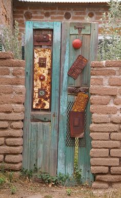 an old wooden door with rusty decorations on it