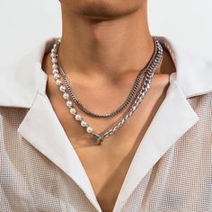 We are proud to present a classic trendy paneled pearl double layer design hip hop necklace. This necklace combines classic pearl elements with a trendy hip-hop twist to create a unique design that will give you an edgy fashion attitude for any occasion.Pearl element:Representing elegance and class, the pearls in the necklace add an elegant vibe to the entire design and elevate your look to another level.Double layer design:The double-layer design gives the necklace more layering and three-dimensionality, making your outfit more interesting and showing your unique understanding of fashion.Stitching hip-hop style:The design of the necklace incorporates elements of hip-hop style, combining classic pearl elements with avant-garde hip-hop style through splicing to create a different fashion at Pearl Necklace Men, Style Hip Hop, Mens Jewelry Necklace, Necklace Sets, Choker Necklace Set, Link Chain Necklace, Chain Choker Necklace, Ring Pendant Necklace, Faux Pearl Necklace