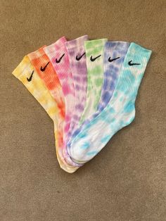 Tie dyed Nike everyday crew socks These are tie dye socks I used to sell on an old Etsy page with 33 sales and 6 5 star reviews! Available in sizes: UK 5-8 UK 6-11 Please note: All tie dyed socks are unique and will not always look the same as the picture  Washing instructions: - Cool Hand wash only as well as avoiding washing with other items of clothing( the first few washes, colour may run, this is normal)  If you have anymore questions, please feel free to message us and we aim to get back t Dyed Socks, Bday List, Senior Stuff, Tie Dye Socks, Diy Socks, Nike Socks, Stocking Filler, Stocking Fillers, Cool Socks