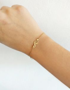 "14K 9K Gold Music Note Bracelet, Treble Clef Charm Bracelet, Dainty Music Note Bracelet, Solid Gold Bracelet, Musician Gift, Music Lover Gift, Christmas Gift, FREE EXPRESS SHIPPING Beautiful and delicate bracelet with a treble clef/note charm made in 14K or 9K solid gold. \"Music gives a soul to the universe, wings to the mind, flight to the imagination and life to everything.\" -- Plato Whisper...I love Music! -------------------------------------------------- D E T A I L S 14K Solid Gold or 9 Musical Note Bracelet, Personalized Band Bracelet For Gift, Personalized Jewelry Band For Gift, Personalized Band Jewelry For Gift, Music-themed Band Jewelry As Gift, Music-themed Band Jewelry Gift, Music-themed Bracelet Jewelry Gift, Music-themed Yellow Gold Jewelry Gift, Music Note Bracelet