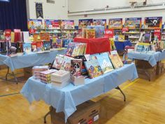 there are many children's books on display at the table in front of them