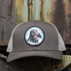 Cool Chessie Dog Hunting Hat by East Coast Waterfowl East coast waterfowl, located in the United States, is a well-known producer of cool hunting hats, t-shirts, and outdoor accessories. The company, proudly based in the United States, has been producing premium quality outdoor products since 2013. They create garments for men, women, children, and the elderly, ensuring everyone has a comfortable hat for when they are out hunting. East coast waterfowl has a deep appreciation for animals and the Hooey Hats, Hunting Hats, Dog Hunting, Hunting Caps, Country Hats, Chesapeake Bay Retriever, Southern Outfits, Dog Patch, Hunting Hat