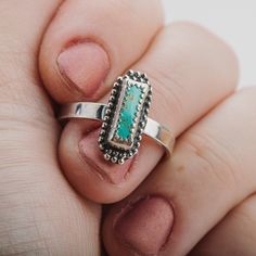 This beautiful ring features a stunning aqua blue Royston turquoise gemstone in a long rectangle shape. The sterling silver setting is adorned with delicate beaded details. This ring is a truly eye-catching piece that would make a wonderful addition to any jewelry collection. The Royston turquoise gemstone is known for its unique color and striking patterns, making it a highly sought-after stone. The aqua blue color of this particular gemstone is simply gorgeous. The long rectangle shape is also Rectangular Turquoise Sterling Silver Ring, Handmade Turquoise Rectangular Rings, Bohemian Jewelry With Rectangular Gemstone, Bohemian Rectangular Gemstone Jewelry, Silver Rectangular Turquoise Gemstone Ring, Rectangular Turquoise Gemstone Ring, Bohemian Sterling Silver Ring With Rectangular Shape, Handmade Silver Turquoise Ring With Rectangular Shape, Handmade Silver Rectangular Turquoise Ring