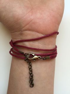 "BUY TWO GET A THIRD FOR FREE!! (please, don't add your free product to your shopping cart or you will be charged for it. Pick 1 product and leave the full name of it in the \"Note to enjoywelrydesign\" Box during checkout.)This is a waxed cotton Karma bracelet with an alloy metal bronze ring charm. What goes around, comes around. Wear your bracelet as a reminder, to keep the circle positive, peaceful and loving. The bracelet is adjustable and fits wrists from 51/2'' to 81/2\" (14cm to 22cm). Fi Bohemian Wrap Bracelet With Sliding Knot As Gift, Bohemian Adjustable Wrap Bracelet Gift, Adjustable Bohemian Wrap Bracelet Gift, Bohemian Jewelry With Adjustable Clasp For Gifts, Bohemian Jewelry With Adjustable Clasp As Gift, Bohemian Jewelry As A Gift With Adjustable Clasp, Bohemian Wrap Bracelet With Adjustable Length As Gift, Adjustable Bohemian Wrap Bracelet As Gift, Resizable Wrap Bracelet For Everyday Use