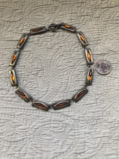 Up for your consideration is a Rare Danish Mid Century Modern Jorgen Jensen Pewter and Amber Glass Choker Toggle Necklace.  This striking necklace measures 16" x 3/8".  It is marked on the back Pewter Jorgen Jensen DENMARK 230.  If you have any questions, please don't hesitate to e-mail me and be sure to check out my other items for sale.  Thanks for looking. Dot Necklace, Danish Mid Century Modern, Toggle Necklace, Vintage Turquoise, Rolo Chain, Jade Pendant, Jewelry Inspo, Amber Glass, Lobster Clasp