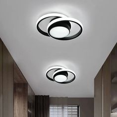 two circular lights are hanging from the ceiling