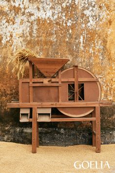 an old wooden bench with hay on top