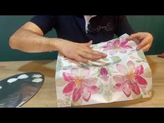 a person that is wrapping something in some paper