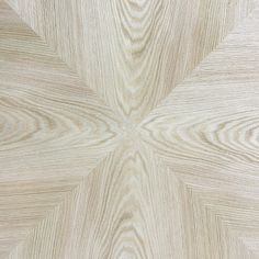 an image of wood textured with natural light brown tones in the center and diagonal lines