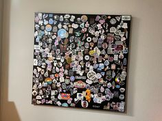 a wall covered in lots of stickers and magnets