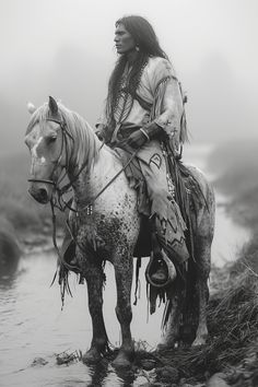 a native american man riding on the back of a horse