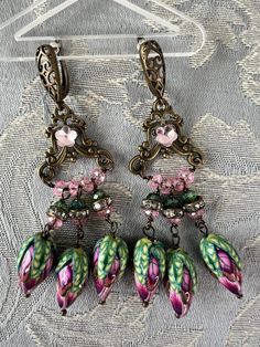 Iron and Rose Buds Earrings - Etsy Bohemian Beaded Earrings With Flower Charm, Vintage Dangle Earrings For Spring, Bohemian Jewelry With Dangling Beads For Spring, Bohemian Spring Jewelry With Dangling Beads, Bohemian Dangle Earrings For Spring, Spring Bohemian Dangle Earrings, Bohemian Flower-shaped Metal Earrings, Spring Dangle Jewelry With Dangling Beads, Bohemian Pink Crystal Earrings For Pierced Ears