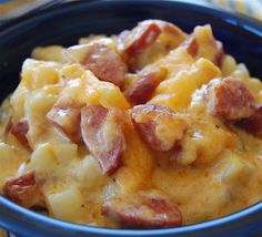 a close up view of some food with cheese and bacon on it's surface