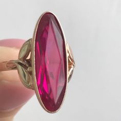 Formal Rose Gold Ruby Ring, Pink Marquise Ruby Ring For Formal Occasions, Formal Pink Marquise Ruby Ring, Formal Marquise Pink Ruby Ring, Classic Ruby Ring Collectible, Collectible Fine Jewelry Ruby Ring, Formal Pink Gold Sapphire Ring, Classic Collectible Ruby Ring, Collectible Ruby Ring In Fine Jewelry Style