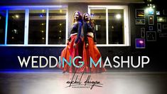 two women are standing in front of a building with the words wedding mashup on it