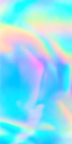 blurry image of an animal in the sky with colors that appear to be blue, pink, yellow and green