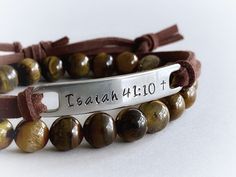 "Wear your favorite inspirational words on your wrist to remind yourself of what matters most to you every day. :) This unisex bracelet features the bible verse \"Isaiah 41:10\", hand stamped into non tarnish stainless steel, with a small cross at the end of the verse. The soft brown faux suede leather cord is adjustable and fits most wrist sizes. You can choose any other short verse you would like under \"personalization\", up to 10 letters works best with this design, but I can squeeze up to 1 Spiritual Leather Bracelet For Everyday, Spiritual Everyday Leather Bracelet, Inspirational Adjustable Bracelets For Personalized Gifts, Brown Hand Stamped Bracelets For Everyday, Inspirational Personalized Faith Name Bracelet, Everyday Brown Hand Stamped Bracelet, Inspirational Engraved Adjustable Name Bracelet, Inspirational Engraved Name Bracelet, Adjustable, Spiritual Adjustable Hand Stamped Bracelets