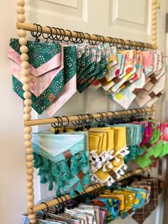 a rack with many different items hanging on it's sides in front of a door