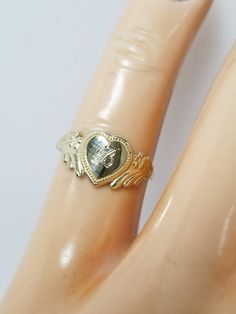 "Thanks for shopping our vintage estate store. We tend to sell well below wholesale and truly hope you enjoy all of our items. Many of the items are one of a kind, so please enjoy scrolling through the pictures and hopefully something will catch your eye. Brown spots are from camera or reflections. Estate 14k yellow gold monogram cursive capital B heart ring. Custom made ring for our shop. Ring size: 3 Setting: 7.5mm 1/4\" to 3/8\" Band width: 1.4mm Weight: .98 gram Marked 14k and it's sweet. On Cursive Capital B, Cursive B, B Heart, Capital B, B Initial, Beach Rings, Antique Style Rings, Gold Monogram, Brown Spots