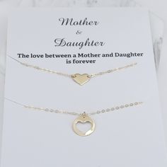 "Mother Daughter Necklace Set. 14K gold necklace Mother's necklace: - 14K gold charm is about 13mm. - 14K gold necklace Daughter's Necklace: - 14K gold heart charm is about 10mm x 8mm - 14K gold necklace Necklace size chart: average 0 - 12 months 10\" average 12 - 24 months 12\" average 2-3 years 13\" average 4-5 years 14\" average 5-10 years 15\"-16\" 14K gold components Your necklaces will be shipped in a gift box. To see other Mother daughter set click here: https://www.etsy.com/shop/SashJewe Mother Daughter Necklaces Set, Other Mother, Mother Daughter Necklace, Mother Daughter Gifts, Daughter Necklace, Mothers Necklace, Gold Heart Necklace, 14k Gold Necklace, Necklace Necklace