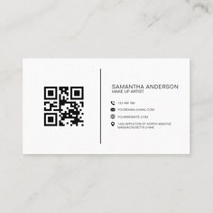 a white business card with a qr code on the front and black letters on the back