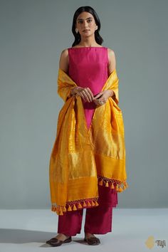 "A timeless dupatta with a mantra handwoven in elegant golden zari. Raw and beautiful - so appealing in its textured appearance and perfect in its imperfections!\n\n\n\n Color\u00a0- A beautiful shade of Mustard with the textured appeal of natural fabric.\n\n\n Technique\u00a0- Classic handwoven Banarasi art passed down through generations\n\n Fabric\u00a0- Textured in appearance, pure Dupion silk\n\n\n Speciality\u00a0- An unusual script pattern, chic and traditional at the same time.\n\n Tilfi Dupatta Styling, Outfit Ideaa, Desi Dress, Stylish Kurtis Design, Simple Kurta Designs, Casual Indian Fashion, Long Kurti Designs, Desi Fashion Casual, Kurti Designs Party Wear